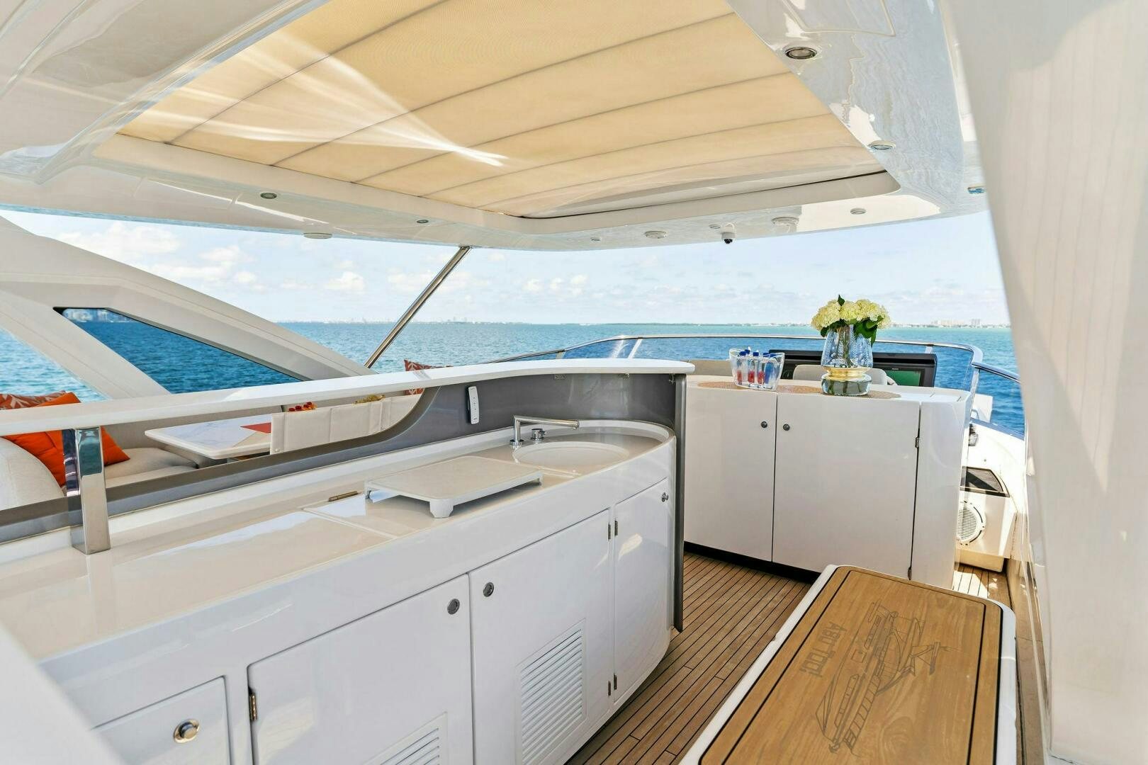 a kitchen with a large window aboard LIMITLESS Yacht for Sale