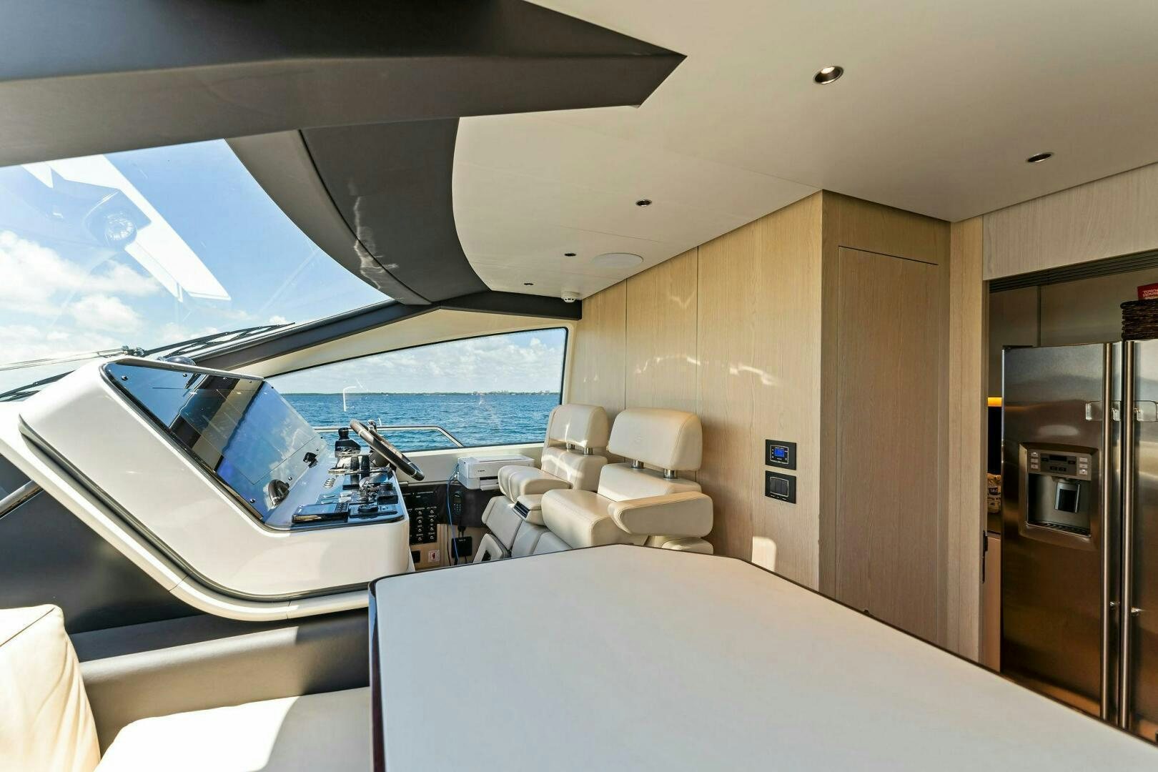 a room with a large window and a view of the ocean aboard LIMITLESS Yacht for Sale