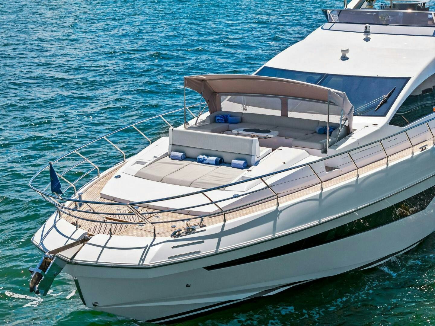 a white boat in the water aboard LIMITLESS Yacht for Sale