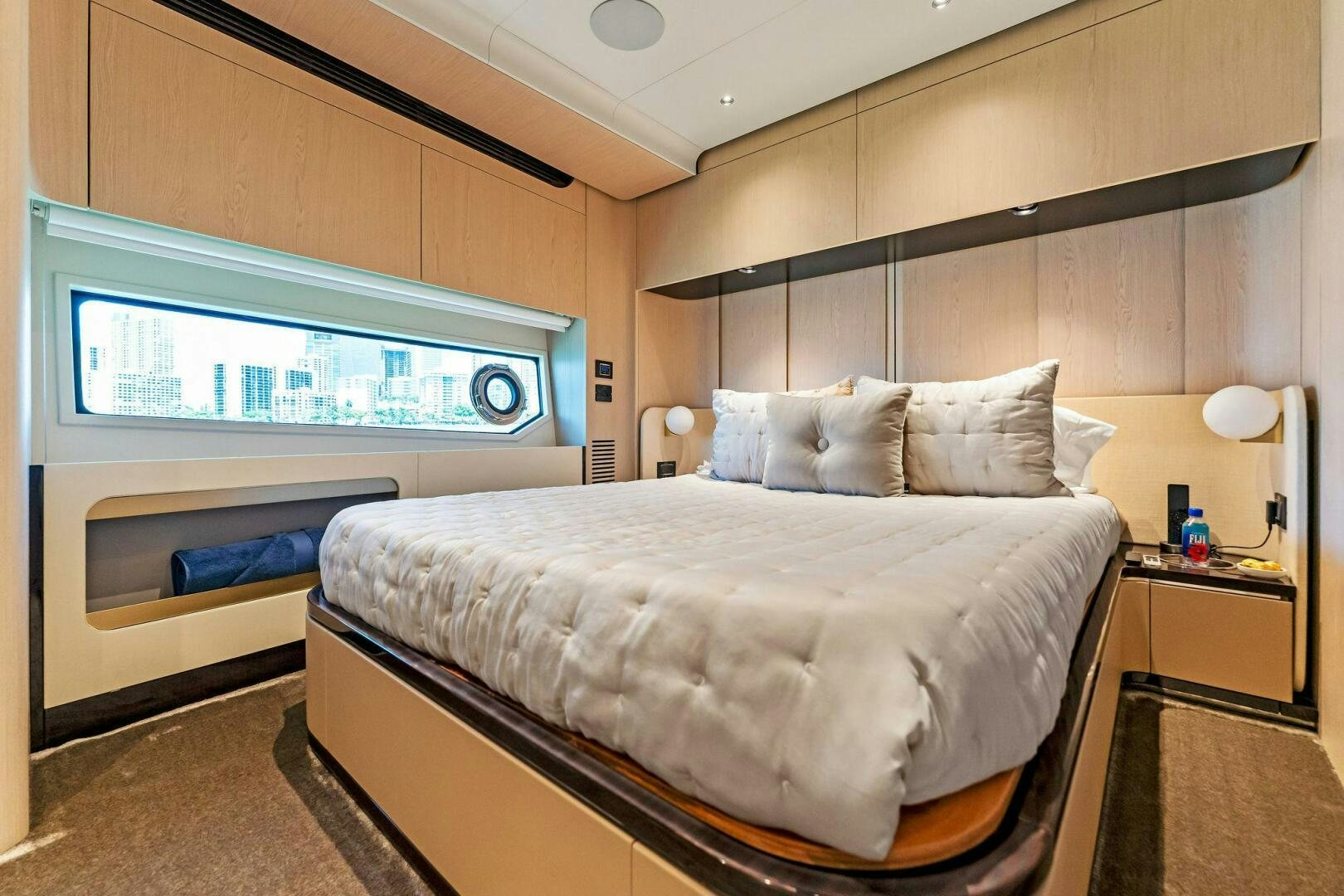 a bed in a room aboard LIMITLESS Yacht for Sale