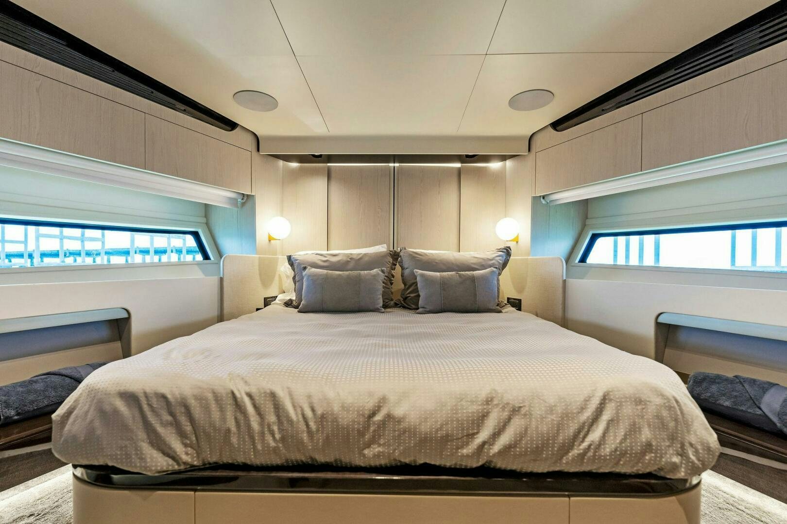 a bed in a room aboard LIMITLESS Yacht for Sale