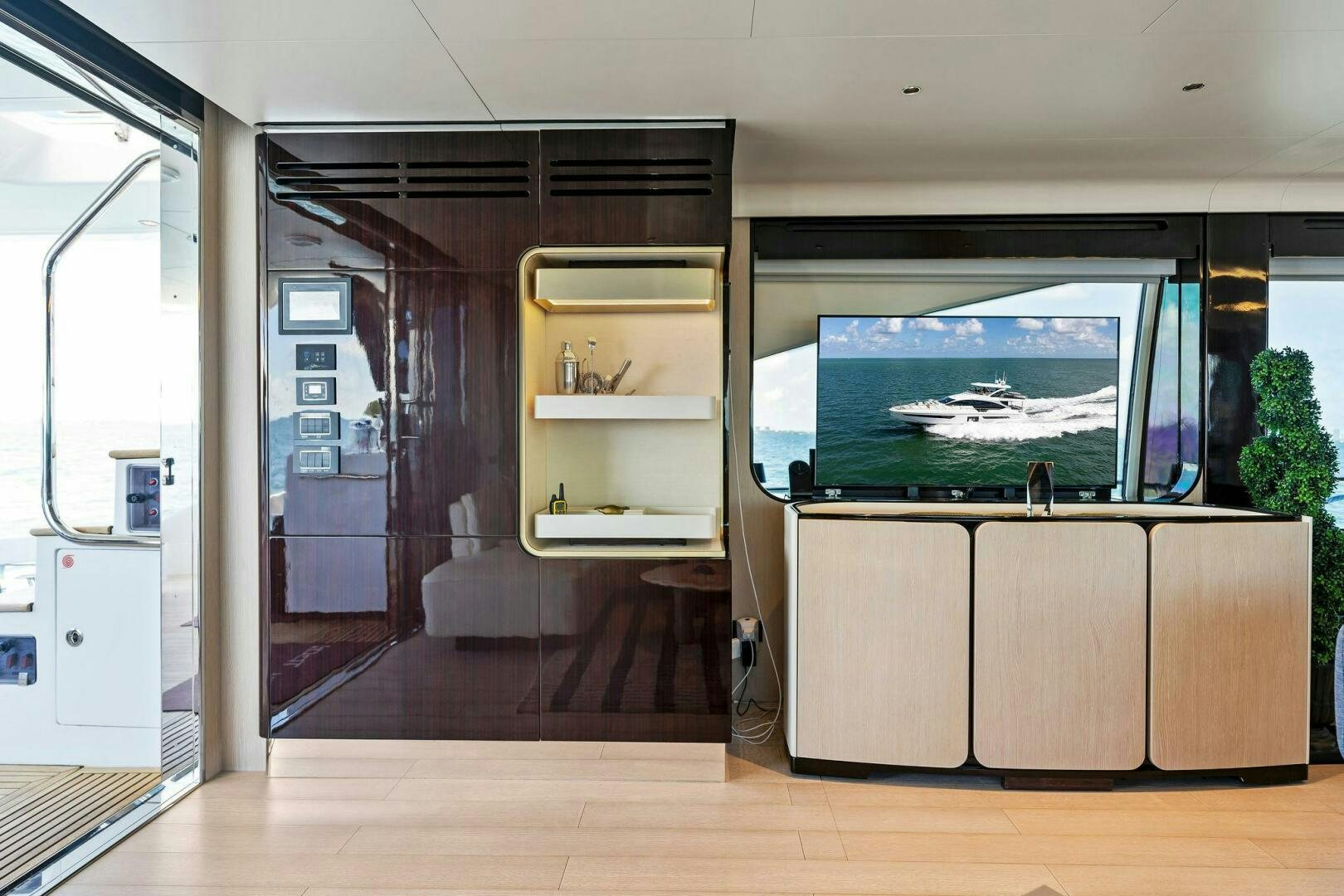 a room with a glass door and a large window aboard LIMITLESS Yacht for Sale