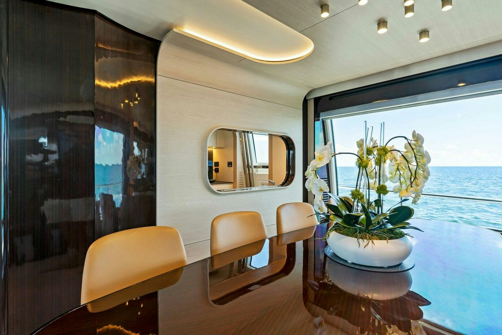 a potted plant on a table aboard LIMITLESS Yacht for Sale