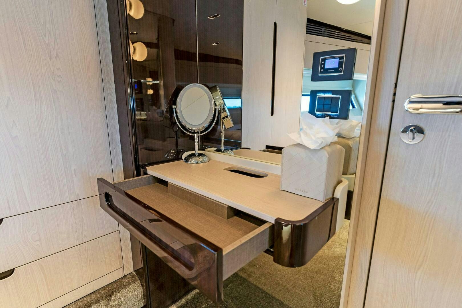 a desk with a fan aboard LIMITLESS Yacht for Sale