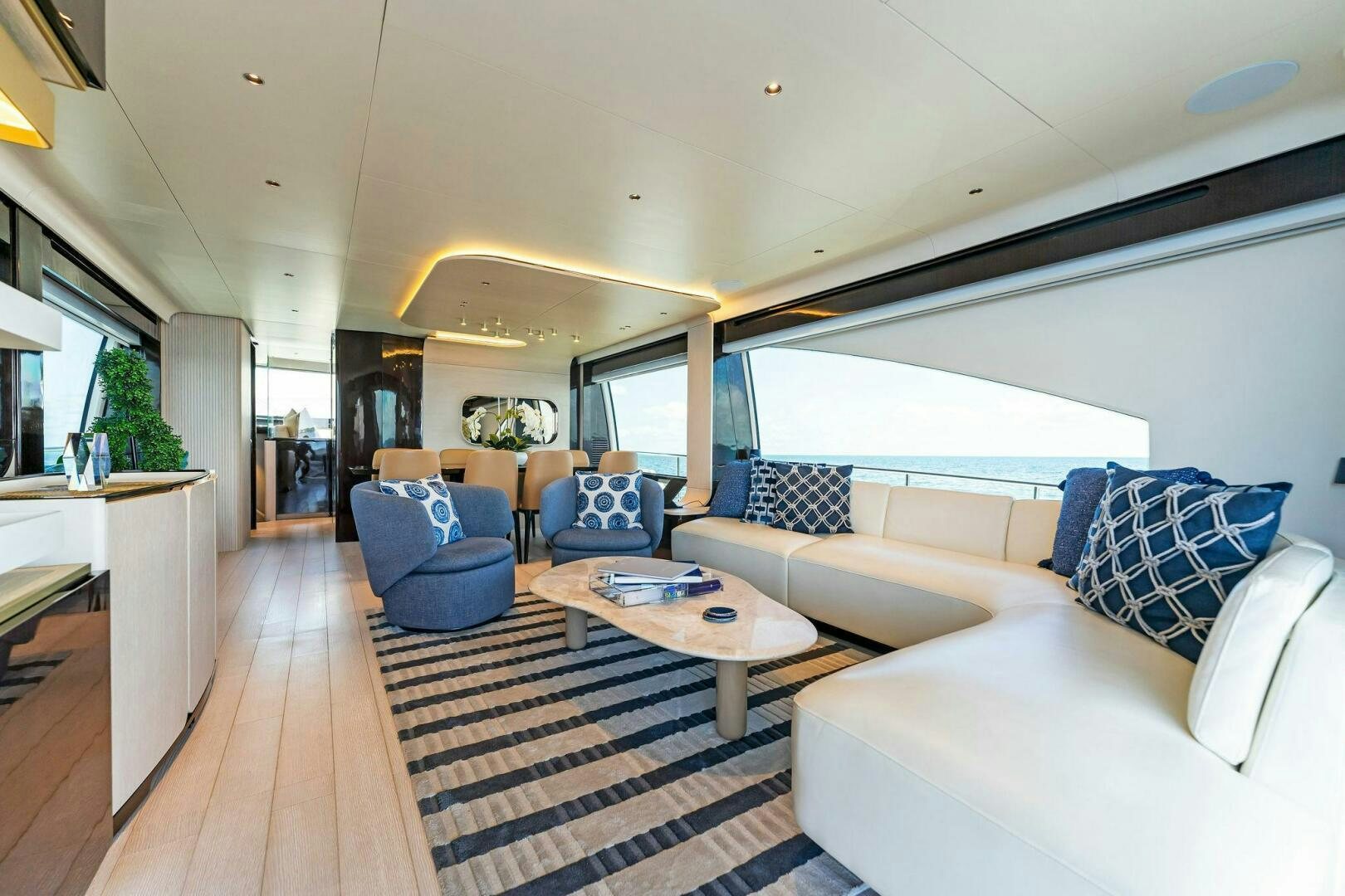 a living room with a large window aboard LIMITLESS Yacht for Sale