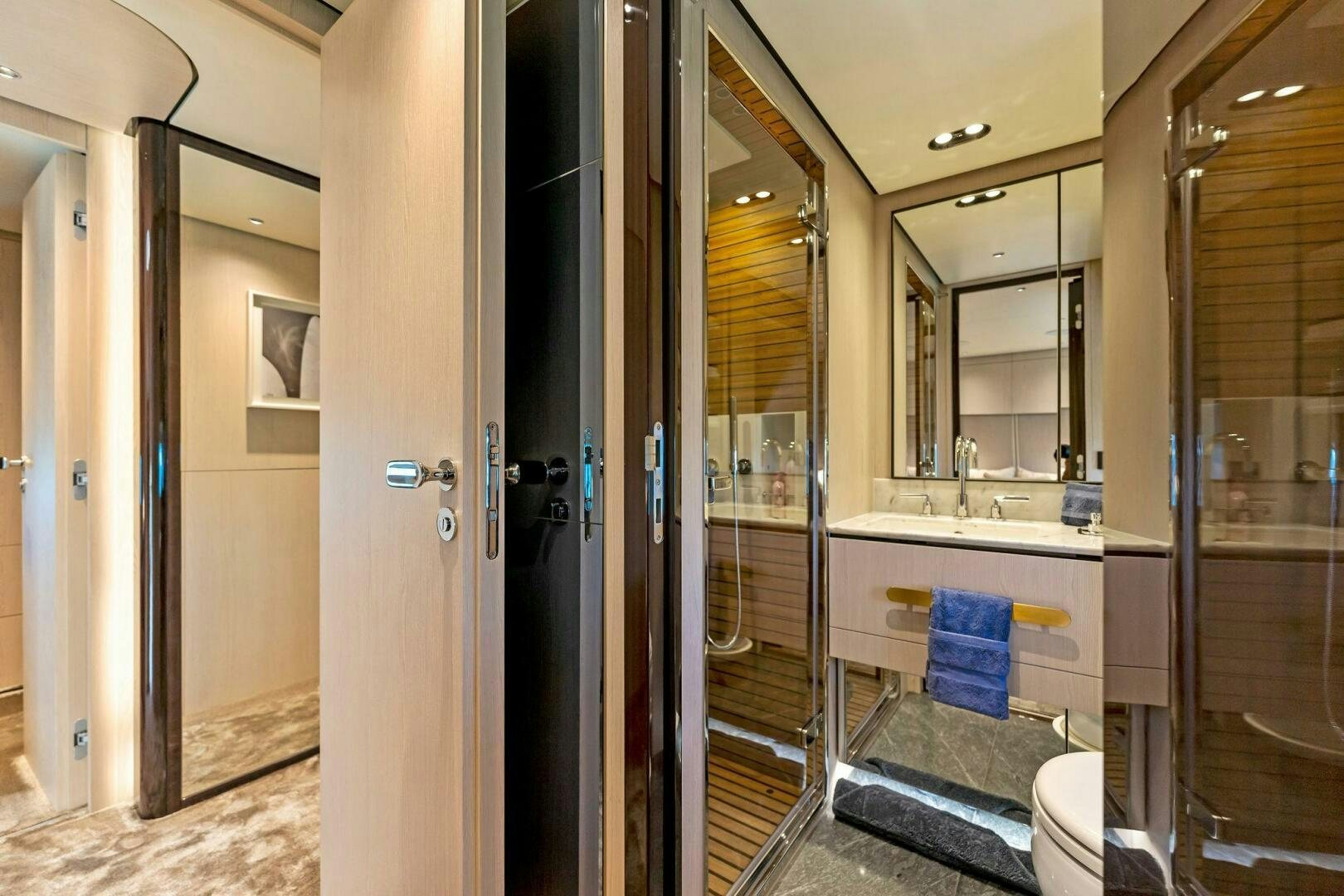 a bathroom with a glass shower aboard LIMITLESS Yacht for Sale