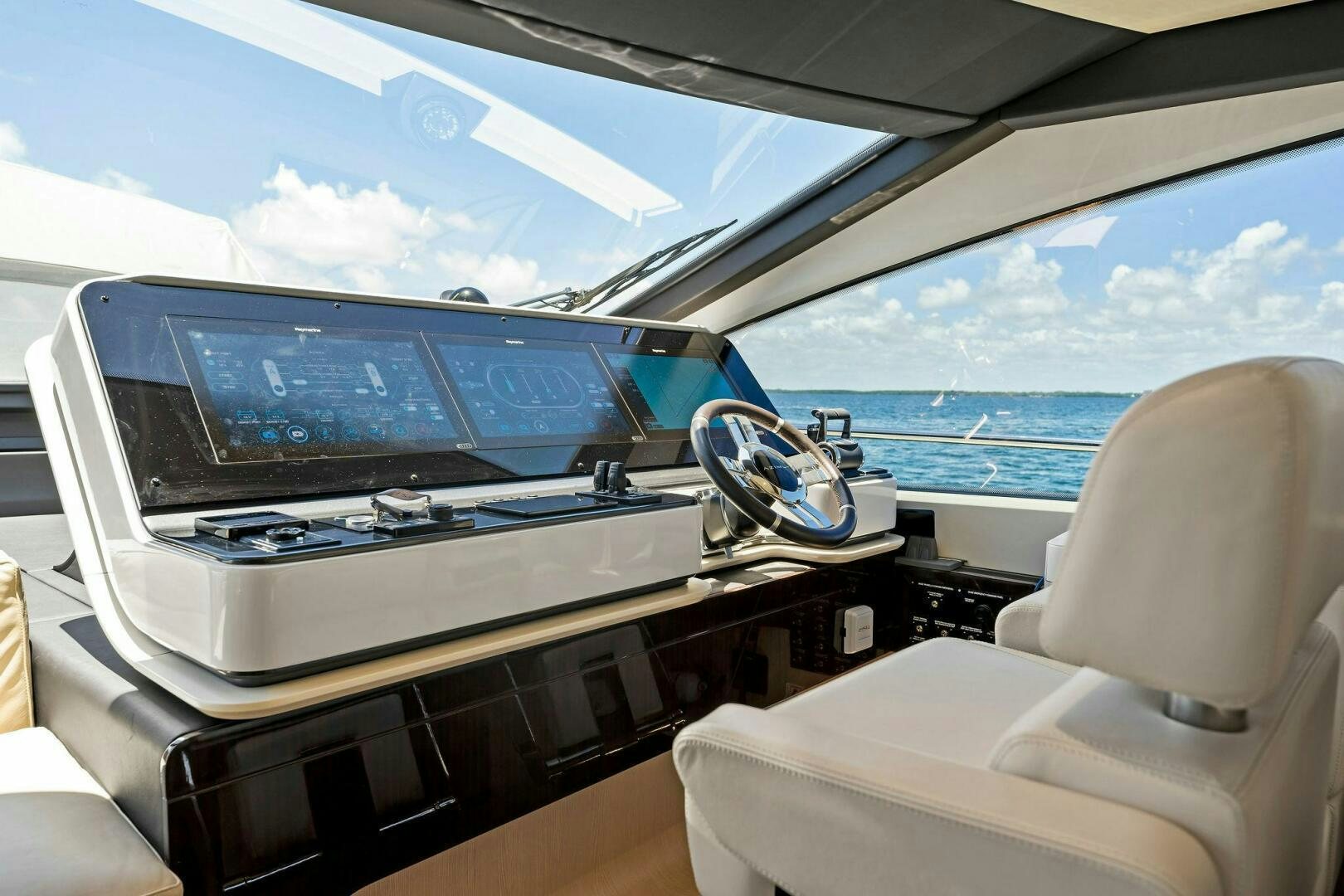 inside of a car aboard LIMITLESS Yacht for Sale
