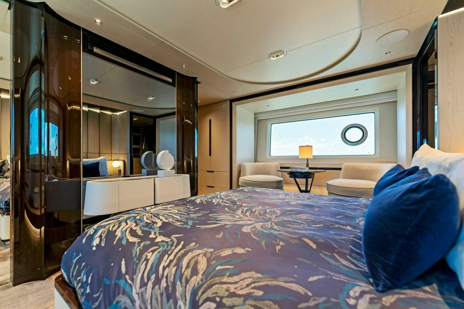 a bed in a room aboard LIMITLESS Yacht for Sale