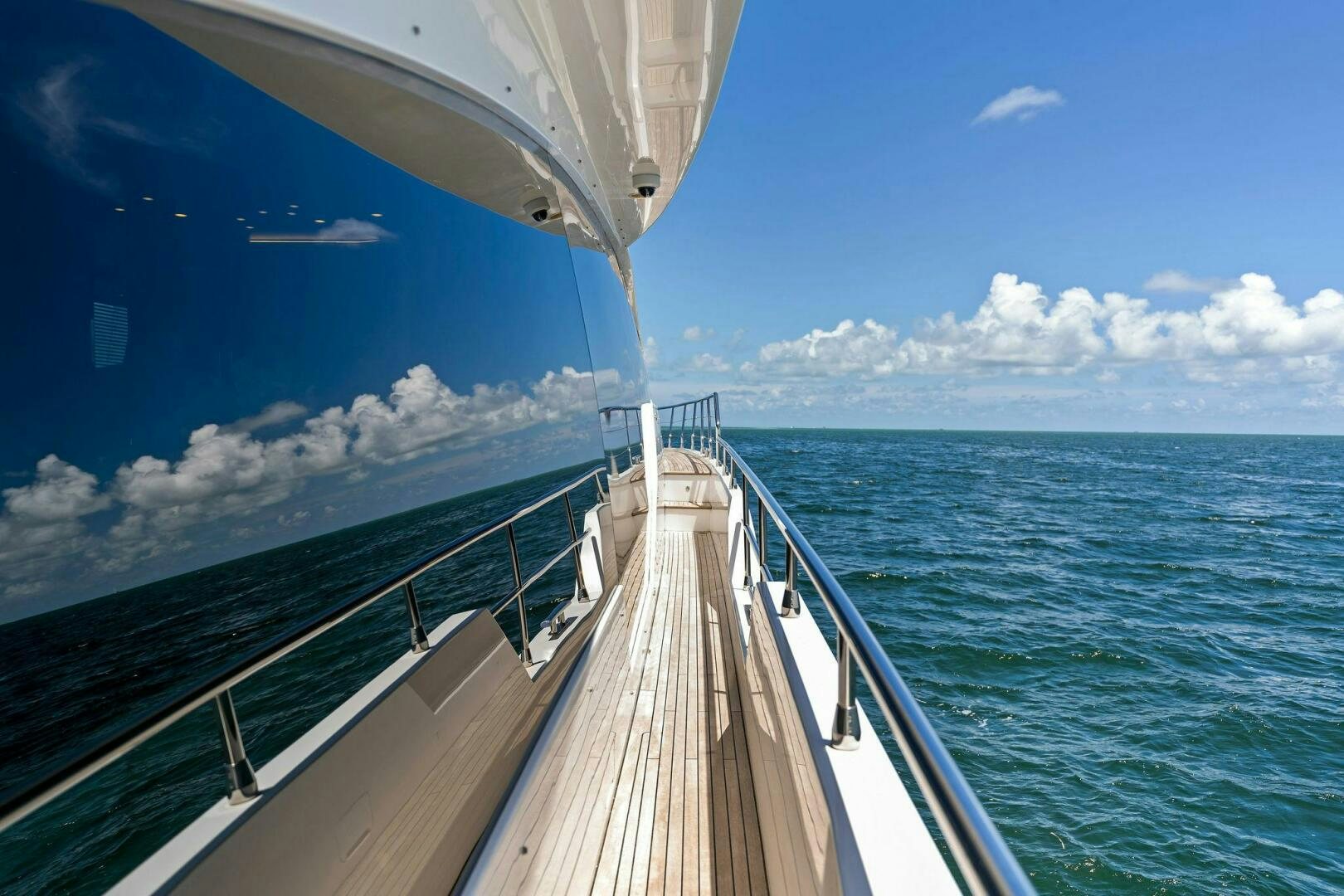 a long dock over the water aboard LIMITLESS Yacht for Sale