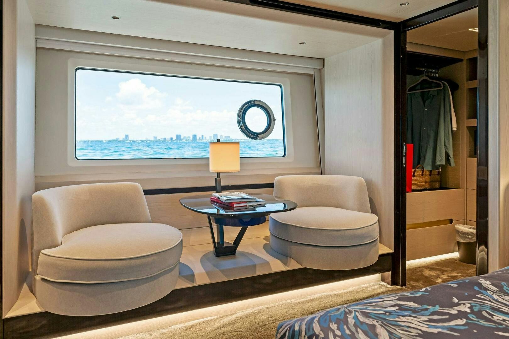 a room with a table chairs and a window aboard LIMITLESS Yacht for Sale