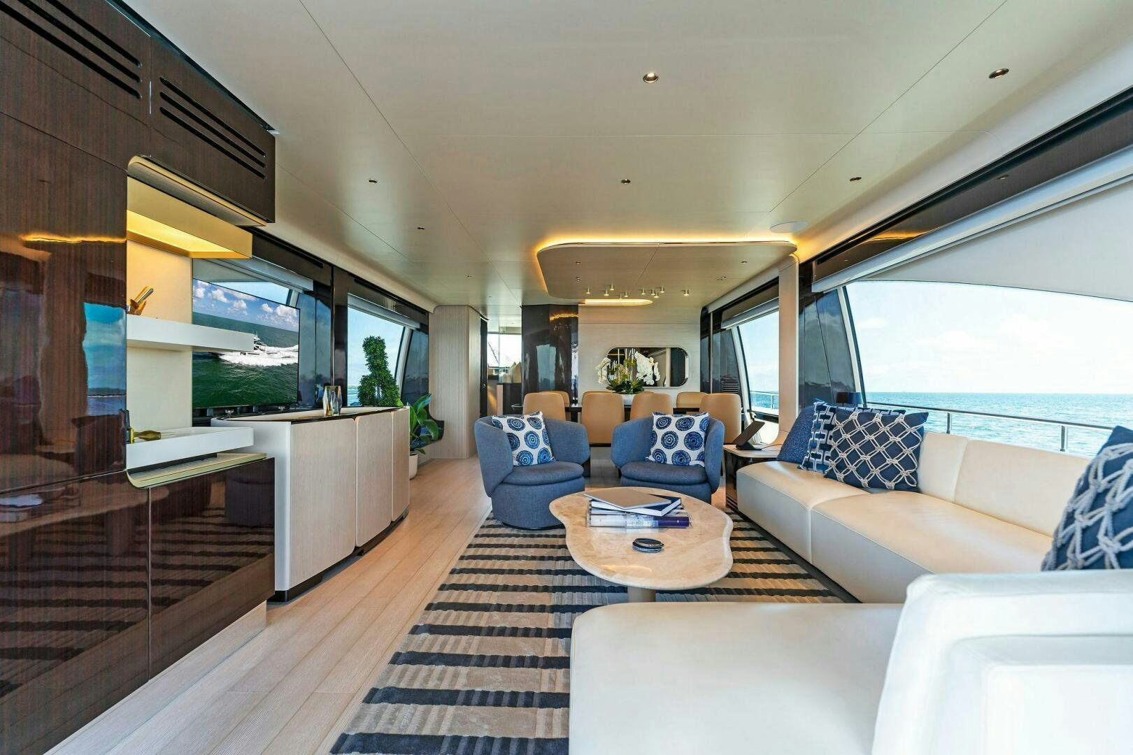 a living room with a large window aboard LIMITLESS Yacht for Sale