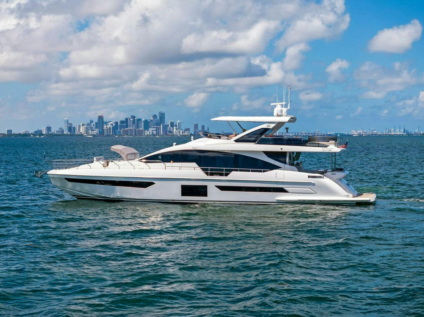 a white yacht in the water aboard LIMITLESS Yacht for Sale