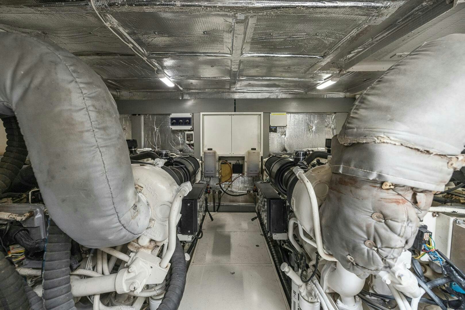 a room full of military vehicles aboard ROOSTERTAIL Yacht for Sale