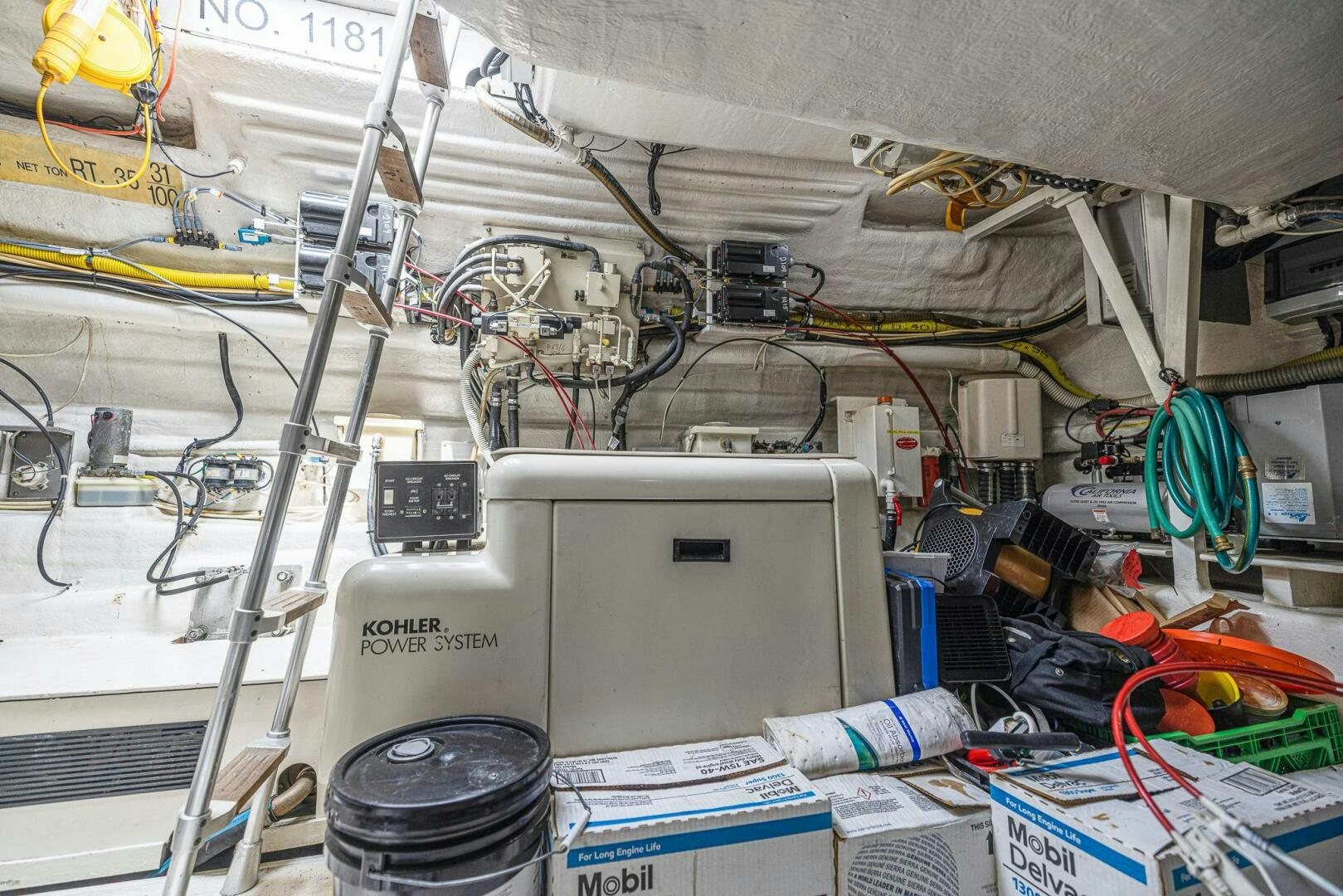 a white rectangular object with wires and a white object on top aboard ROOSTERTAIL Yacht for Sale