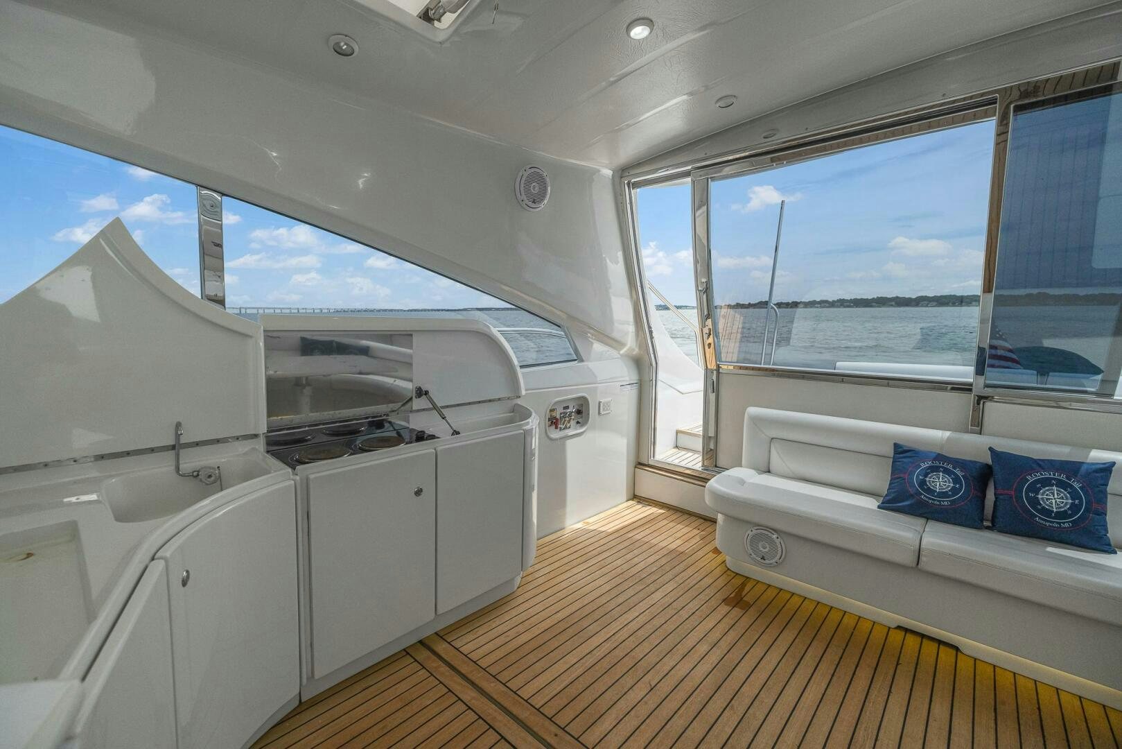 a room with a bed and a large window aboard ROOSTERTAIL Yacht for Sale