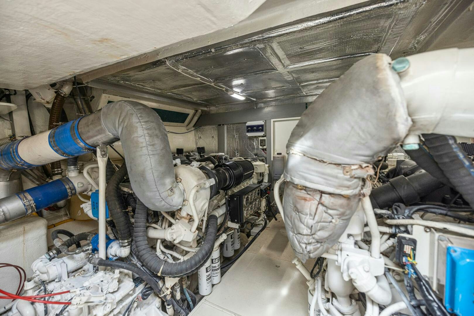 a person working on a machine aboard ROOSTERTAIL Yacht for Sale