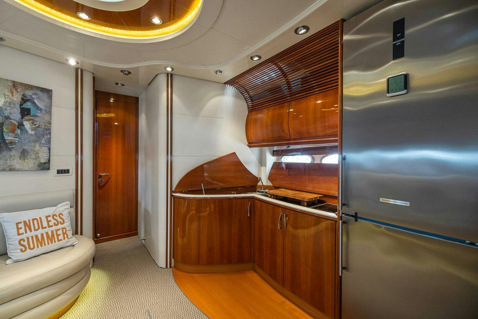 a room with a bed and a desk aboard ROOSTERTAIL Yacht for Sale