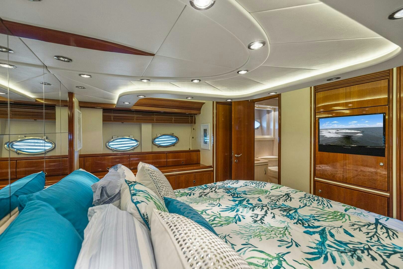 a room with a bed and a television aboard ROOSTERTAIL Yacht for Sale