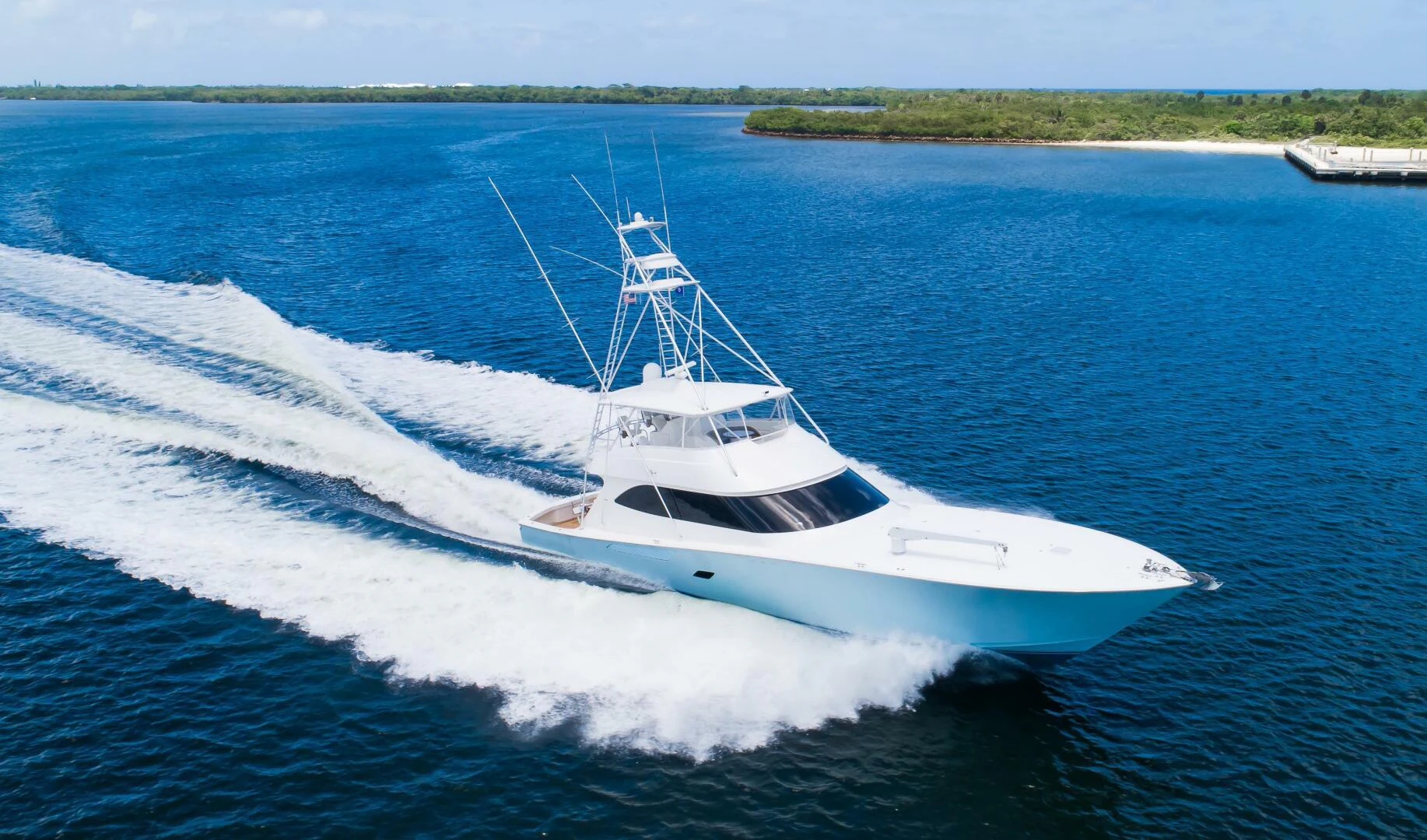a white boat on water aboard DONE DEAL Yacht for Sale