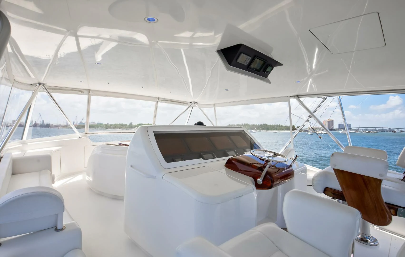 a boat with a table and chairs aboard DONE DEAL Yacht for Sale