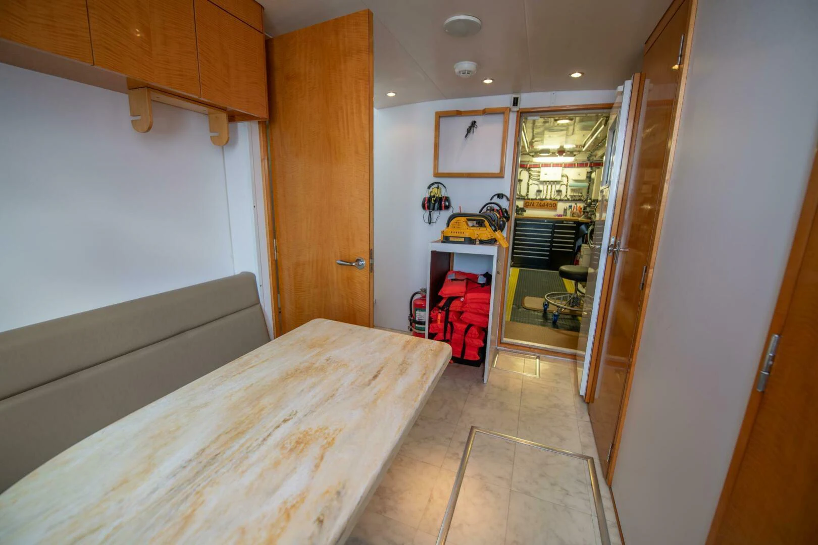 a bedroom with a bed and a closet aboard TIME-2 FLY Yacht for Sale