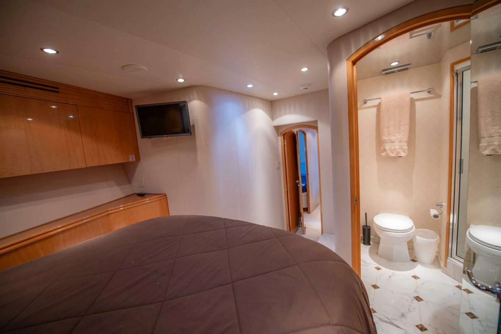 a bathroom with a bed and a television aboard TIME-2 FLY Yacht for Sale