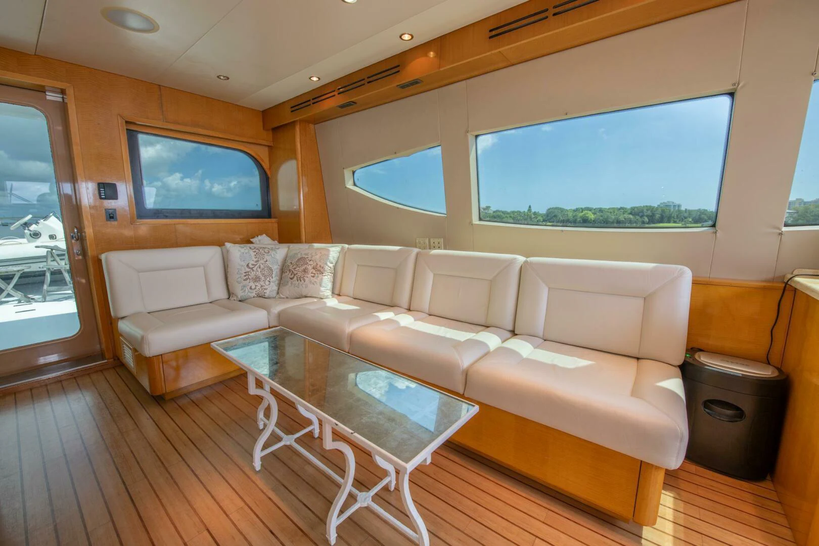 a living room with a large window aboard TIME-2 FLY Yacht for Sale