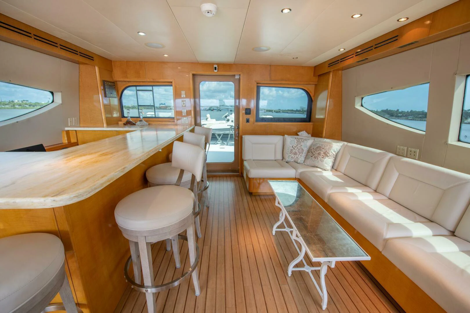 a room with a couch and a table and a television aboard TIME-2 FLY Yacht for Sale