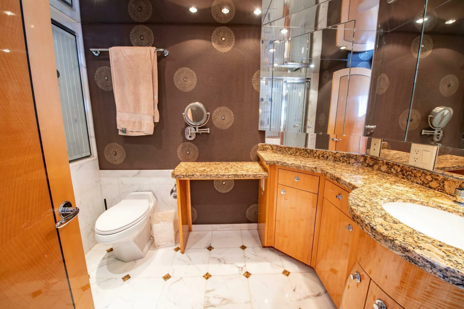 a bathroom with a marble counter top aboard TIME-2 FLY Yacht for Sale