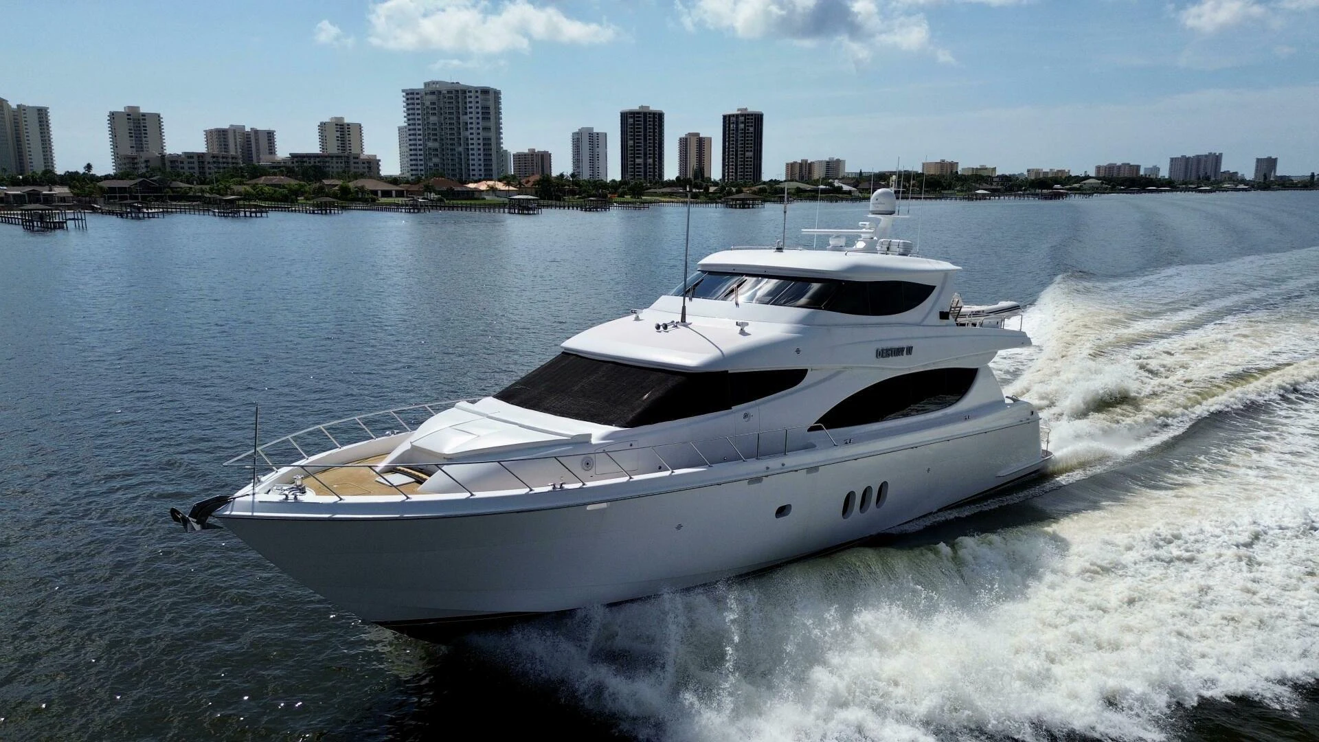a white yacht on the water aboard TIME-2 FLY Yacht for Sale