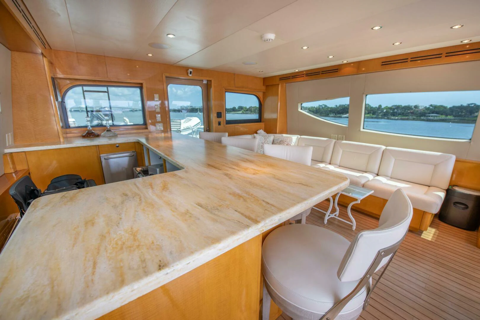 a large room with a large table and chairs aboard TIME-2 FLY Yacht for Sale