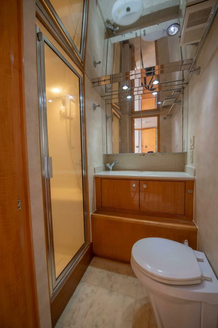 a bathroom with a toilet and a shower unit aboard TIME-2 FLY Yacht for Sale