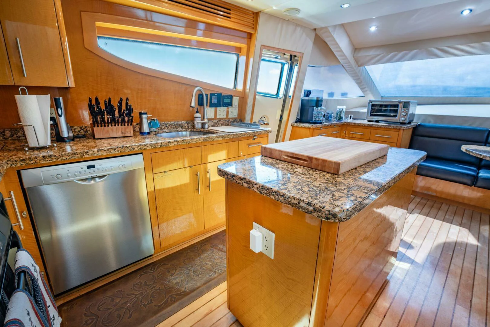 a kitchen with wooden cabinets aboard TIME-2 FLY Yacht for Sale