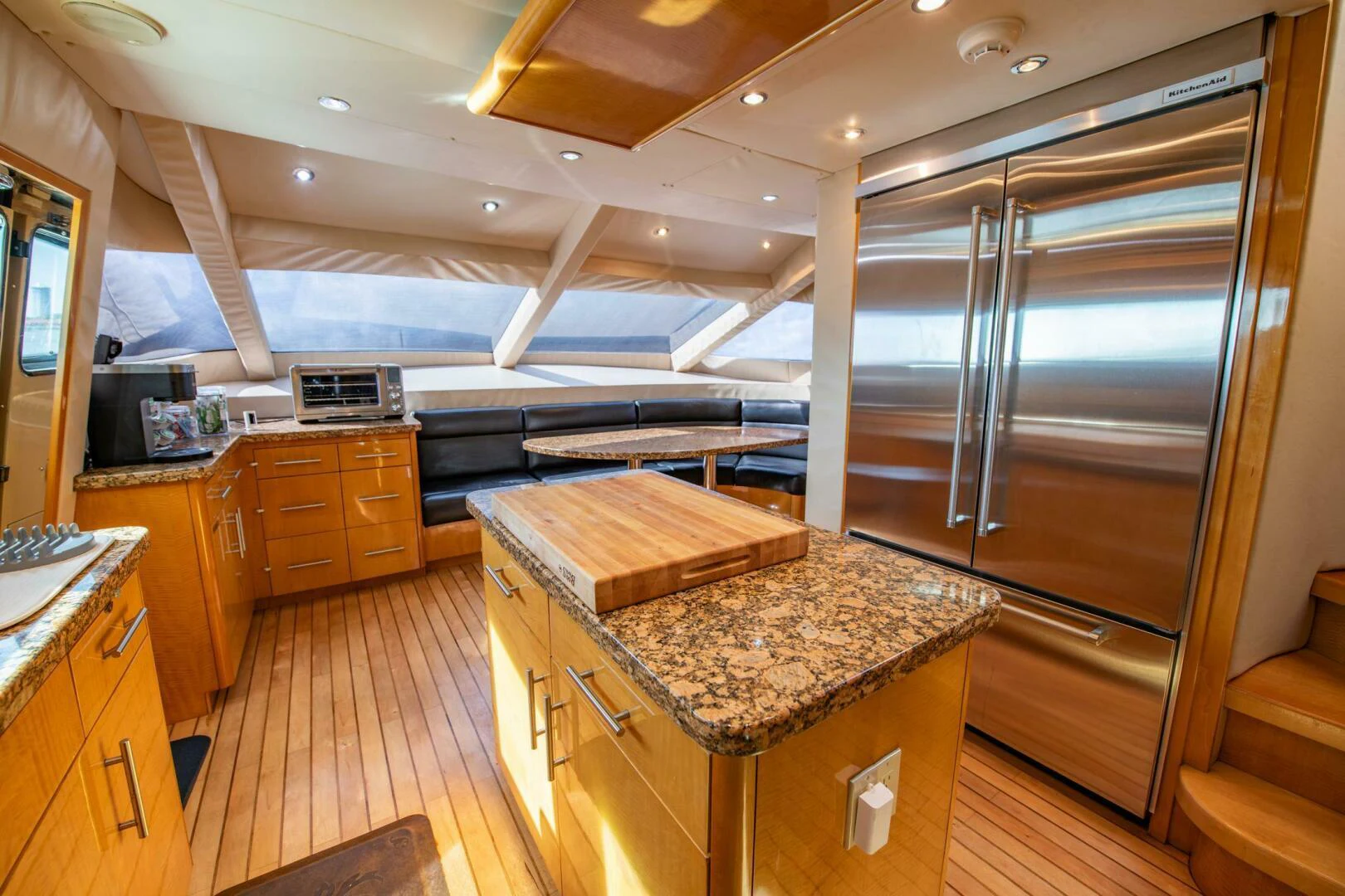 a kitchen with a large glass shower aboard TIME-2 FLY Yacht for Sale