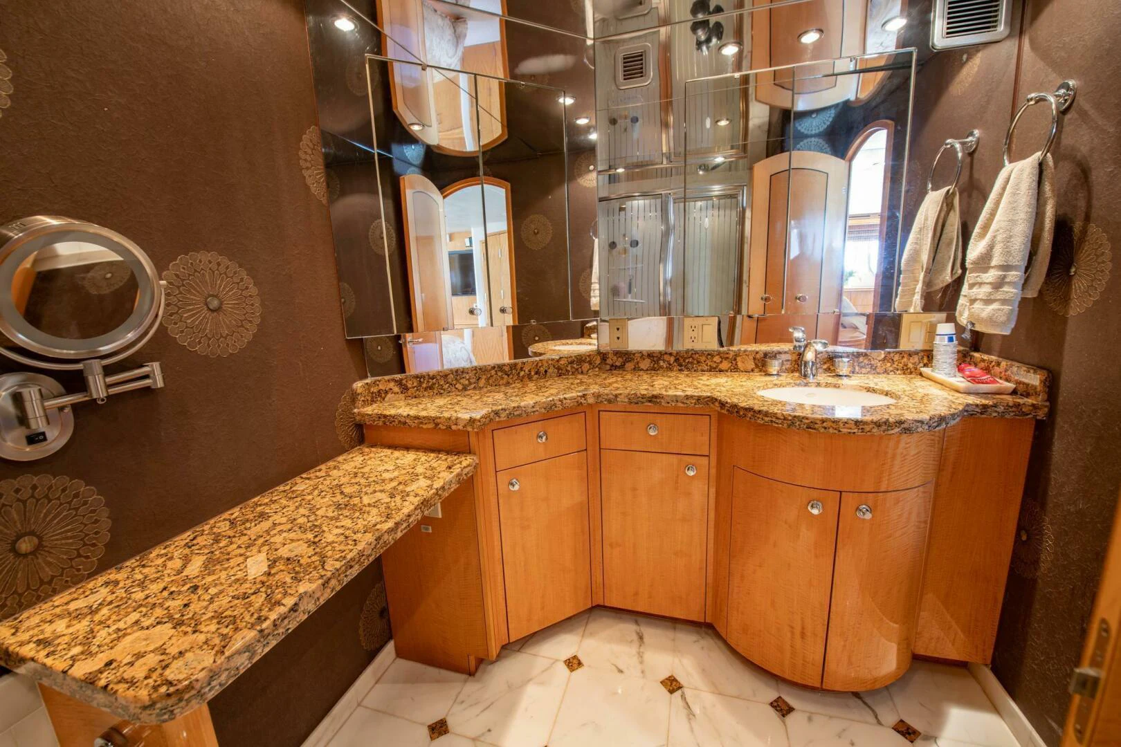 a bathroom with a marble counter top aboard TIME-2 FLY Yacht for Sale