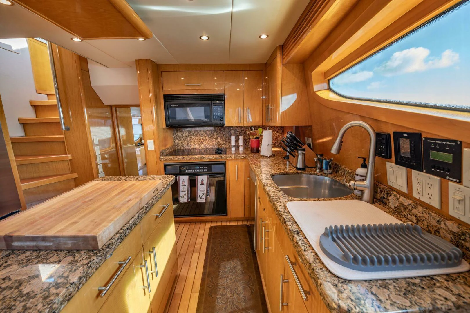 a kitchen with a sink and stove aboard TIME-2 FLY Yacht for Sale