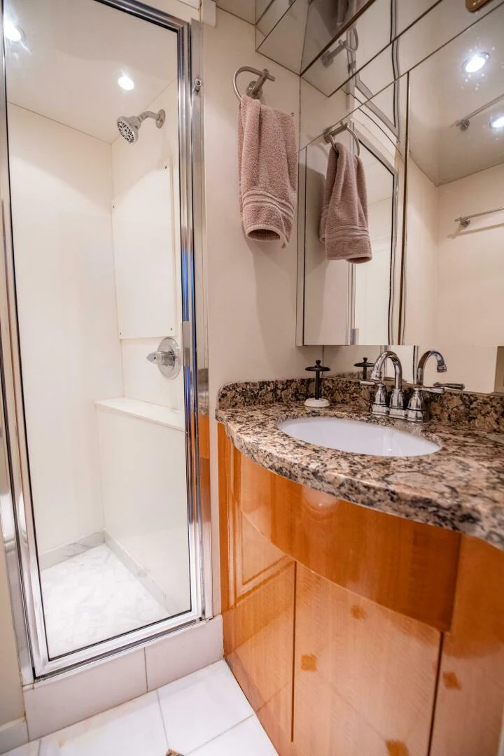 a bathroom with a sink and a shower aboard TIME-2 FLY Yacht for Sale