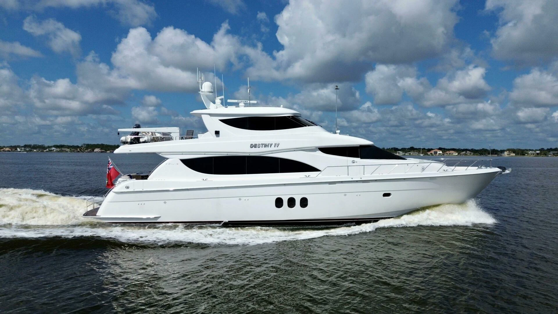 a white yacht on a beach aboard TIME-2 FLY Yacht for Sale