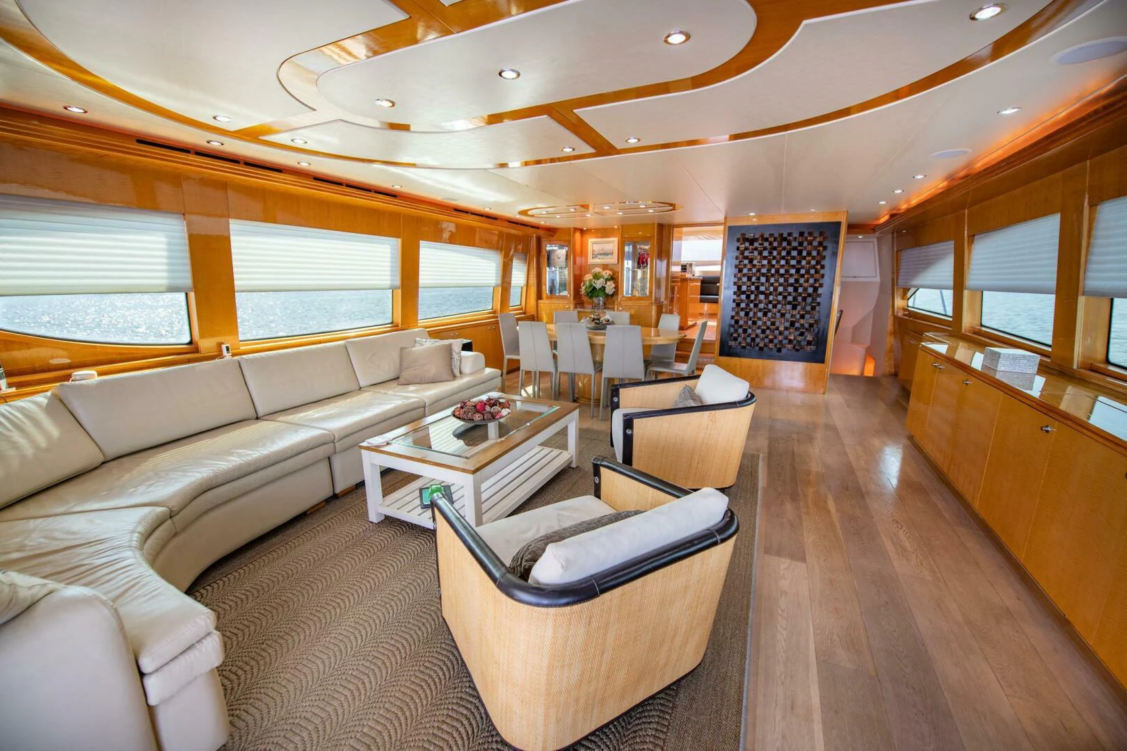 a living room with a couch and a table aboard TIME-2 FLY Yacht for Sale