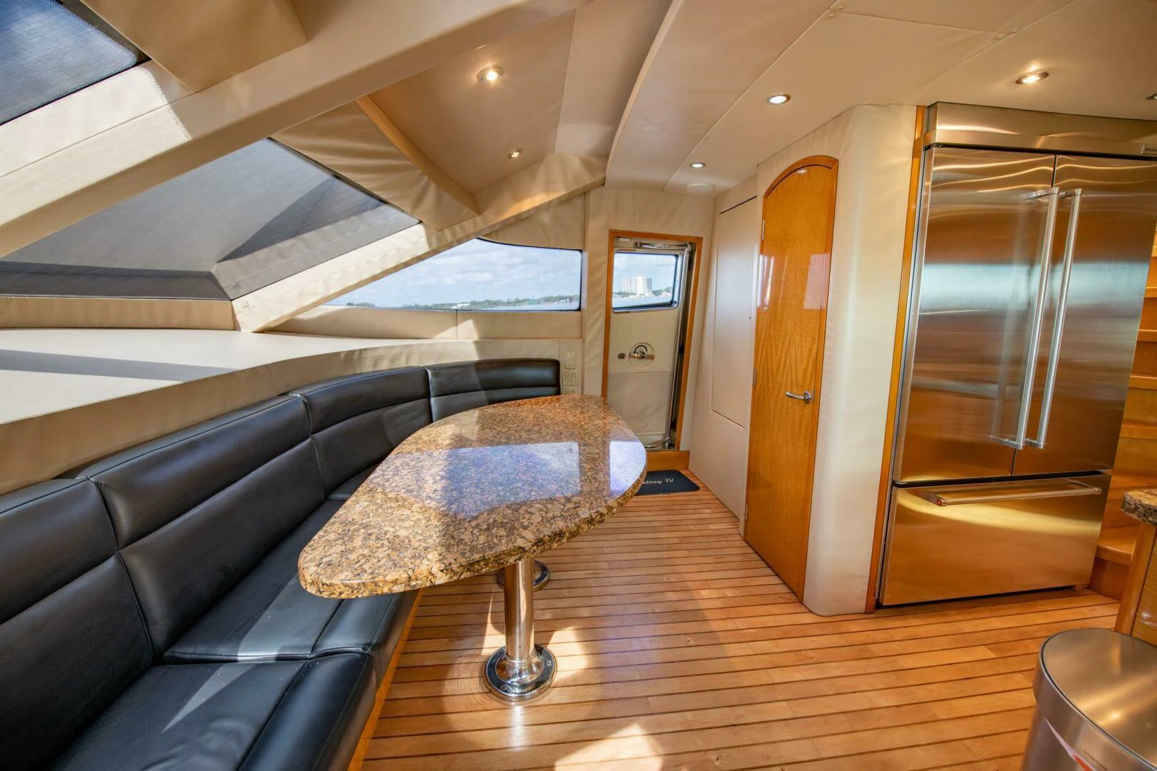 a room with a couch and a table aboard TIME-2 FLY Yacht for Sale