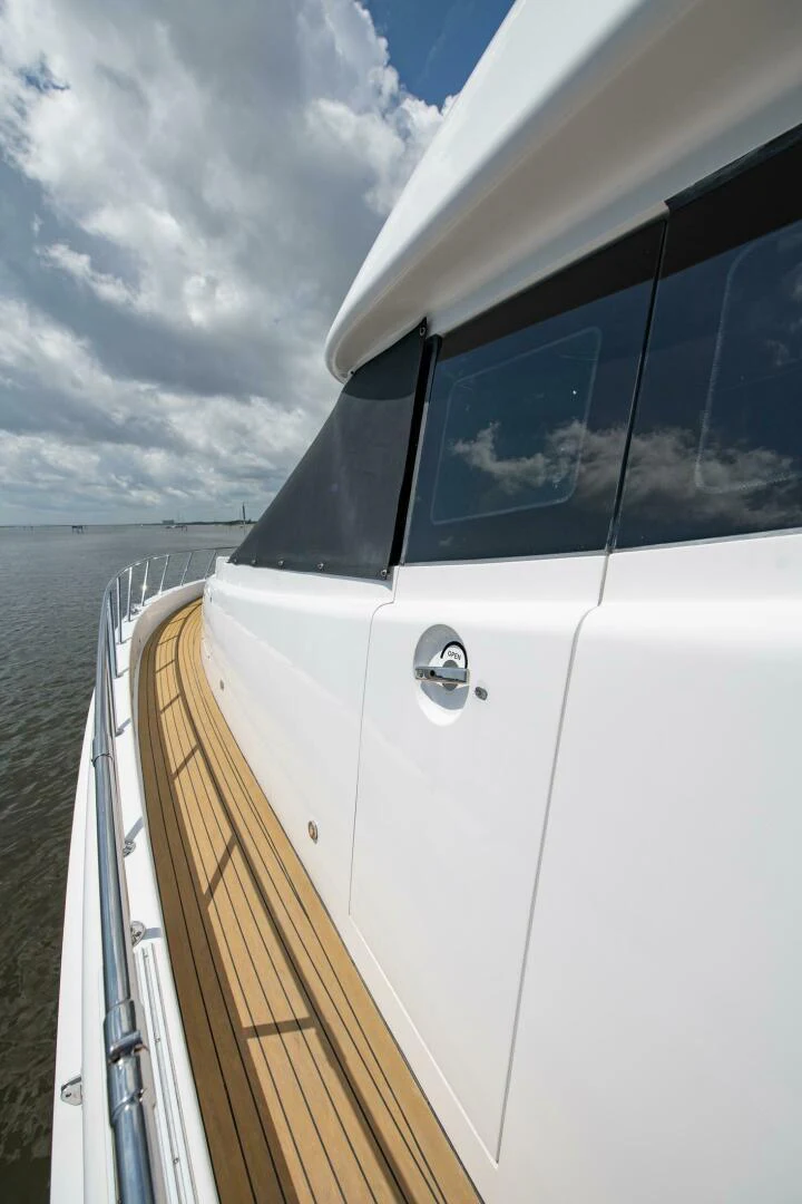 a white car on a boat aboard TIME-2 FLY Yacht for Sale