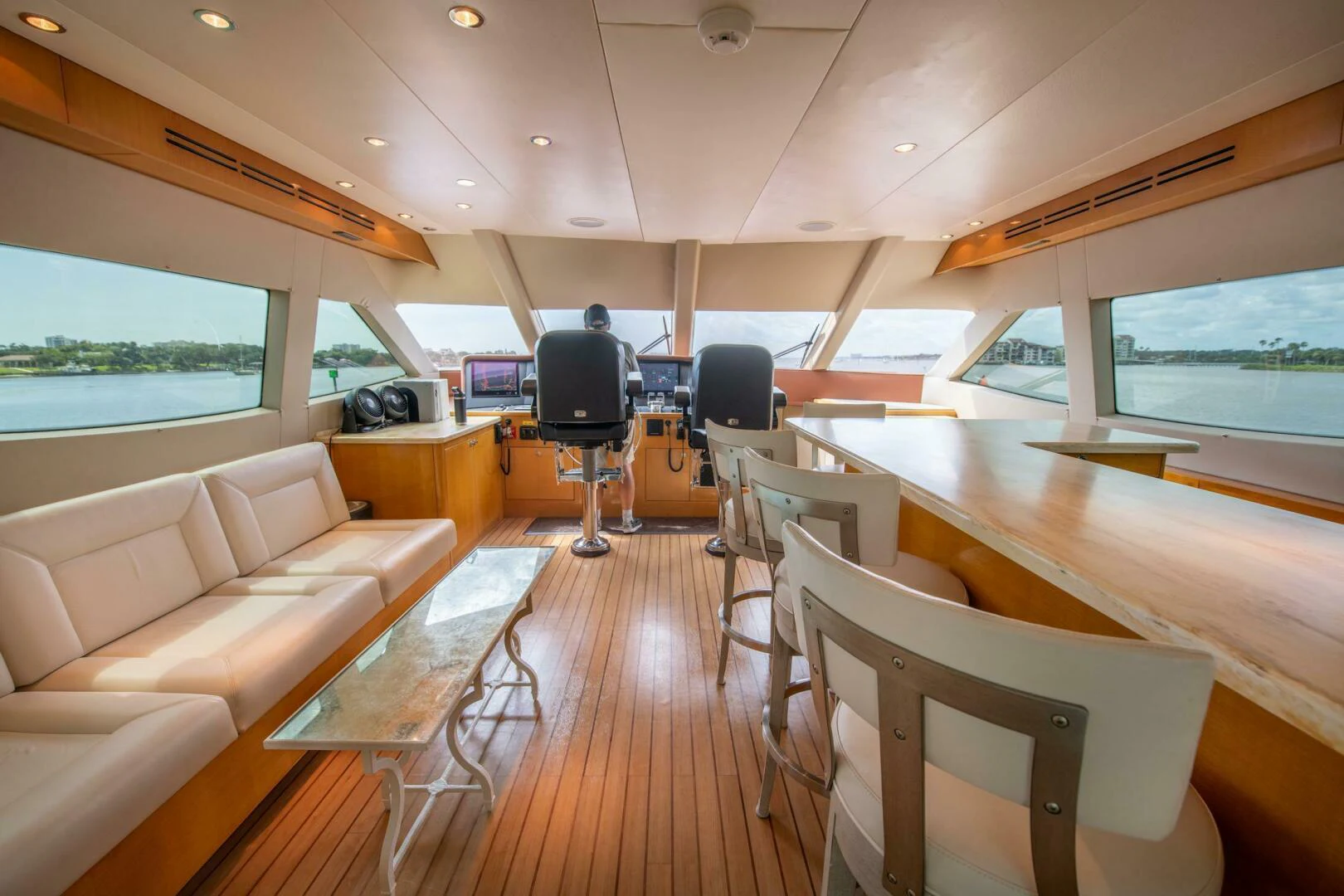a room with a couch and a tv aboard TIME-2 FLY Yacht for Sale
