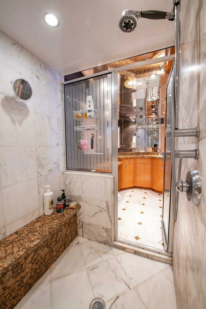 a bathroom with a glass shower aboard TIME-2 FLY Yacht for Sale