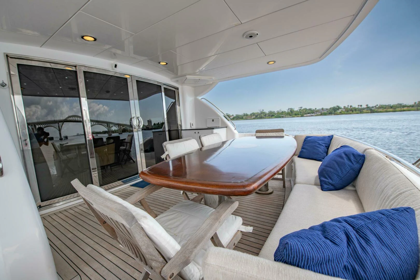 a boat with a table and chairs aboard TIME-2 FLY Yacht for Sale