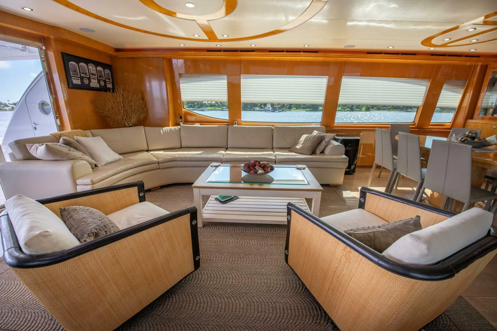 a living room with a couch and a table aboard TIME-2 FLY Yacht for Sale