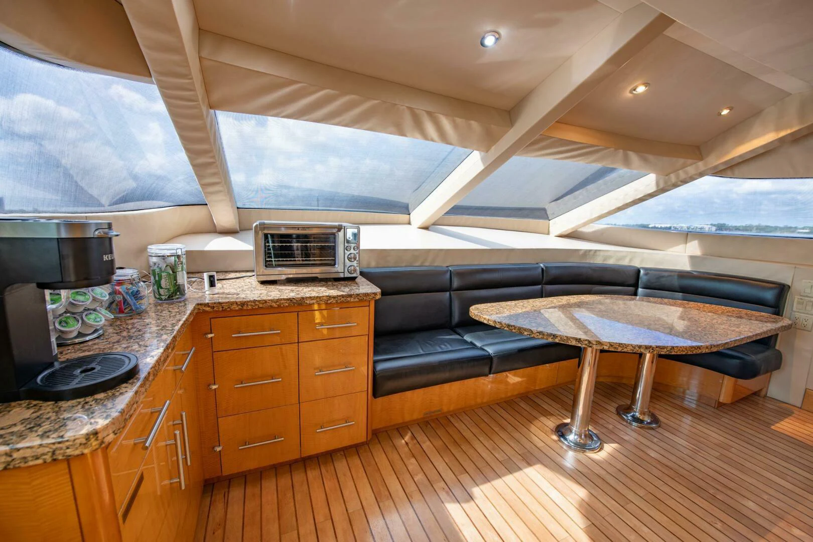 a kitchen with a pool table aboard TIME-2 FLY Yacht for Sale