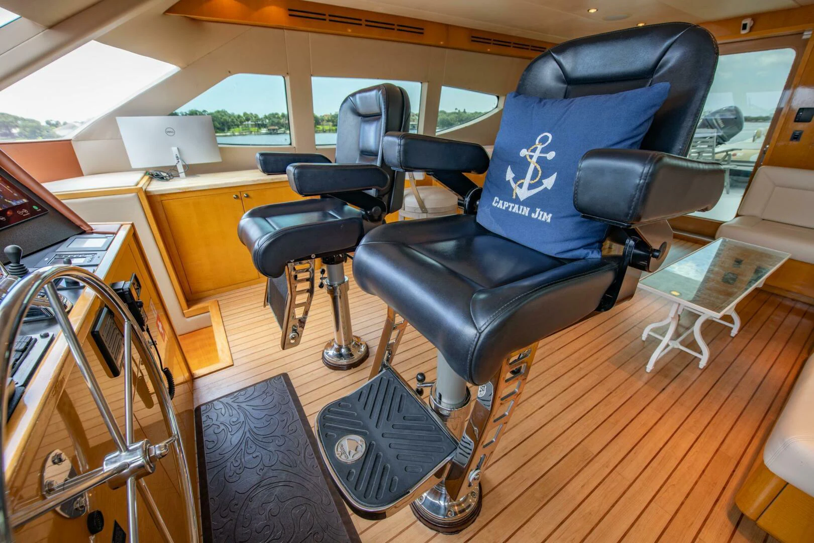 a black chair in a room aboard TIME-2 FLY Yacht for Sale
