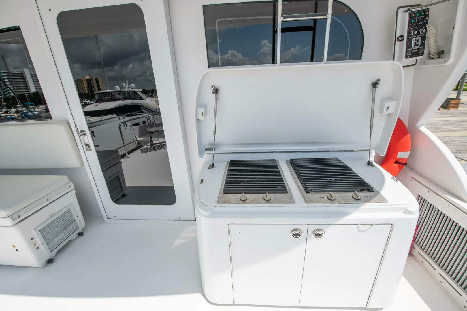 a white machine with a door open aboard TIME-2 FLY Yacht for Sale