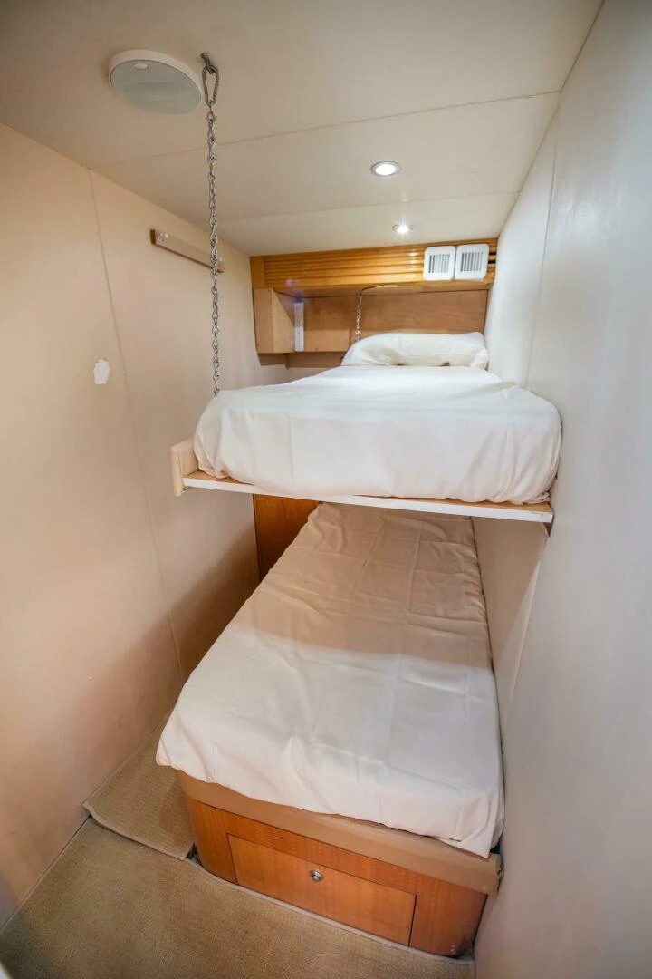 a couple of beds in a room aboard TIME-2 FLY Yacht for Sale