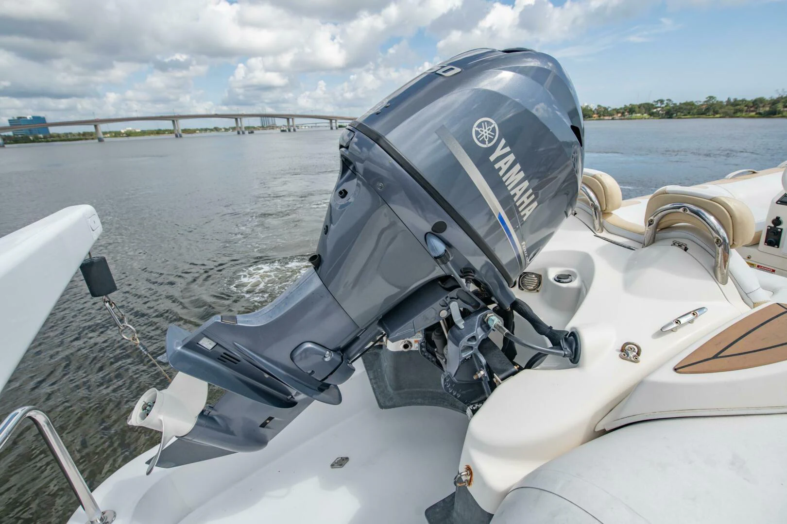 a boat with a motor and steering wheel on it aboard TIME-2 FLY Yacht for Sale